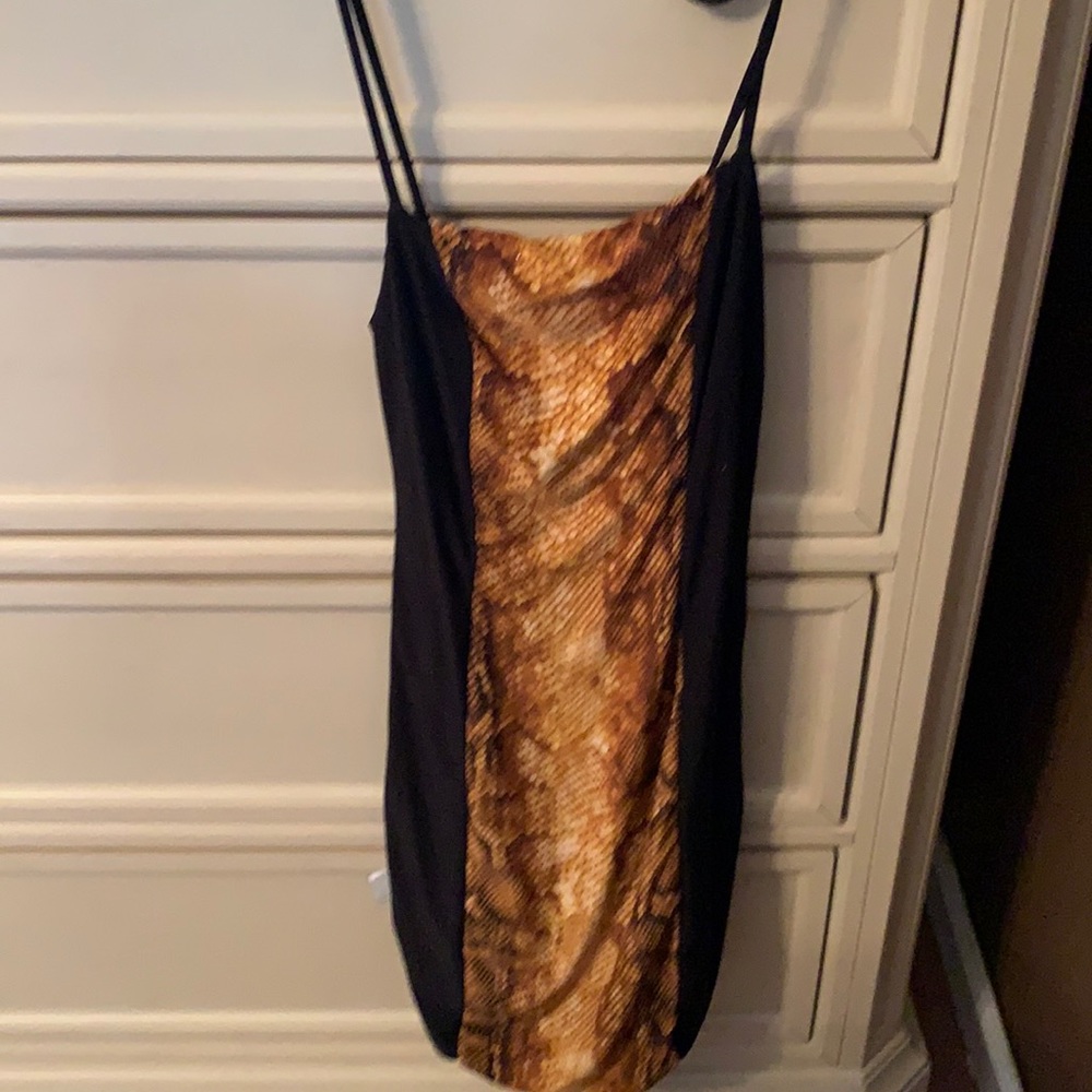 It is a black dress with cheetah hints